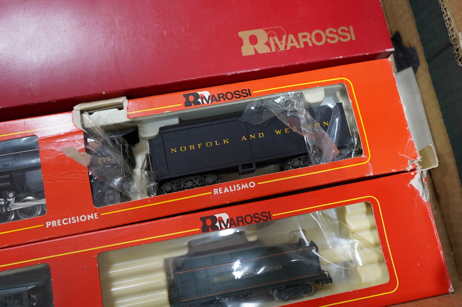 Three boxed Rivarossi HO gauge railway American outline tender locomotives; a Southern Pacific Lines 2-8-8-4, 4294, (1547), a Norfolk and Western 2-8-8-2, 2197, (1238), and a B&O 4-6-2, President Fillmore, (1540). Condit